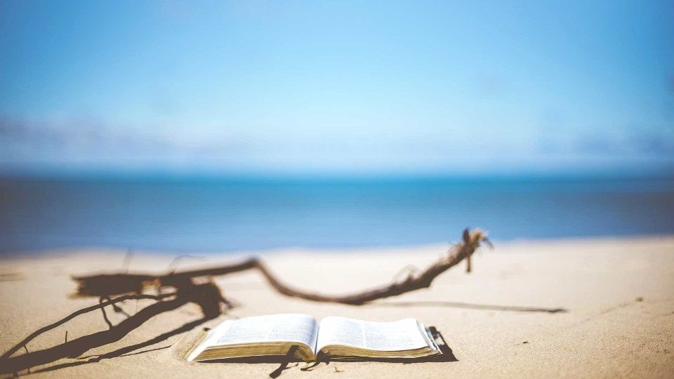 Open book on beach