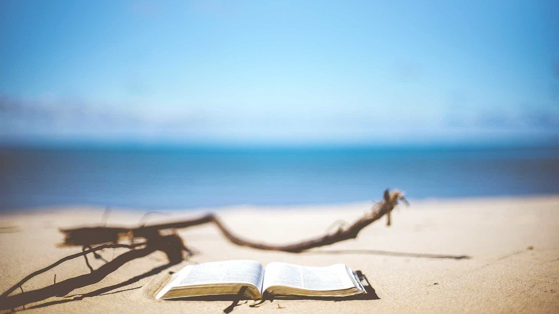Open book on beach.