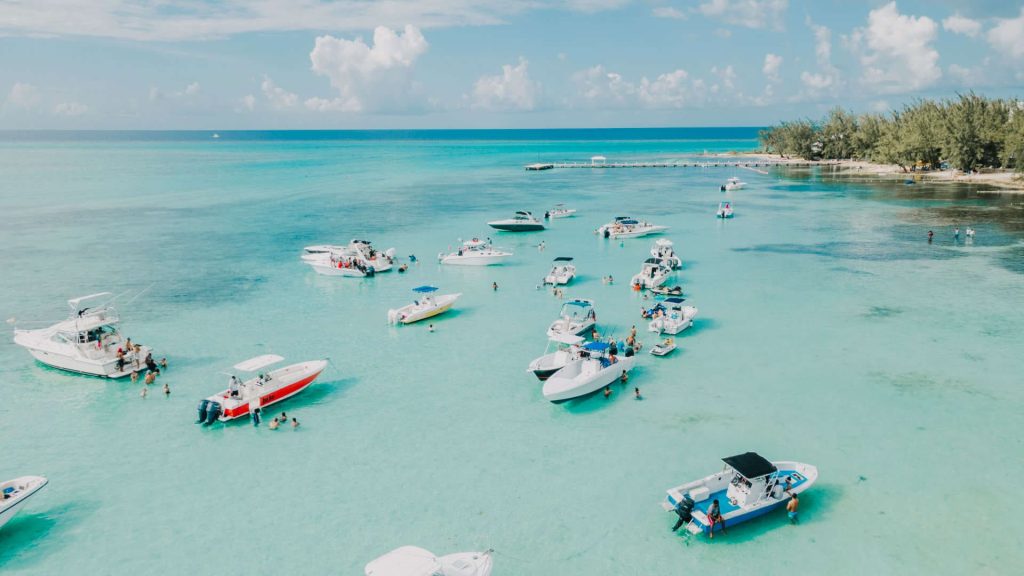 Boats at beach on the Cayman Islands