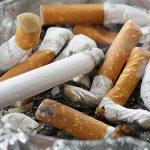Cigarettes in glass ashtray