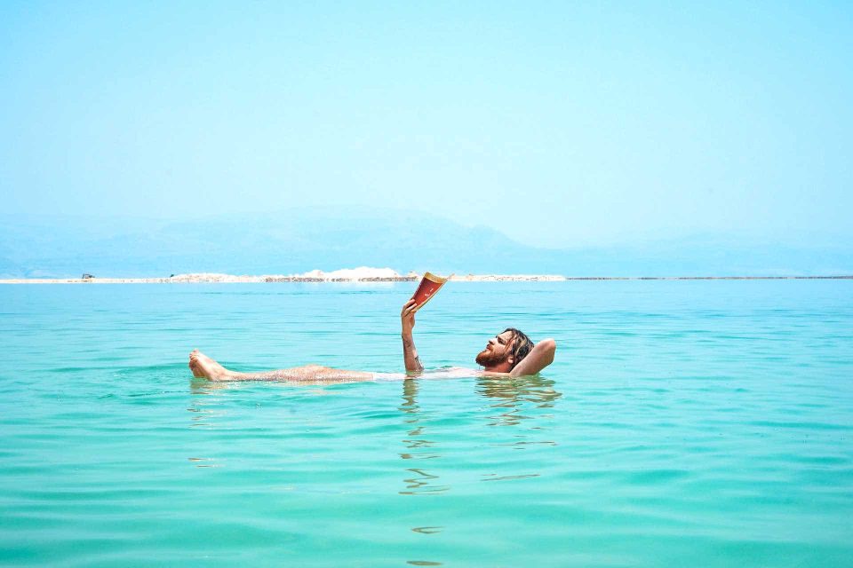 Scuba diving weight check: How to do it the right way 9 Man reading in Dead Sea floating on surface