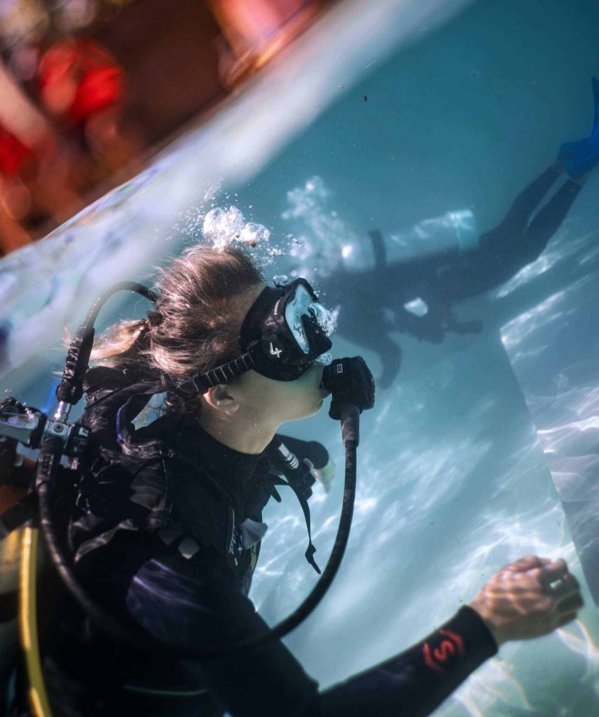 Divers in pool