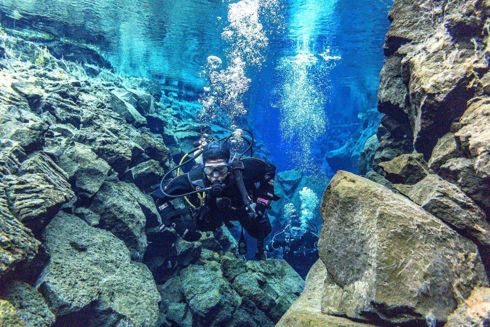 Scuba divers in Silfra rift