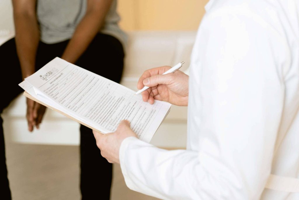 Doctor holding medical examination sheet