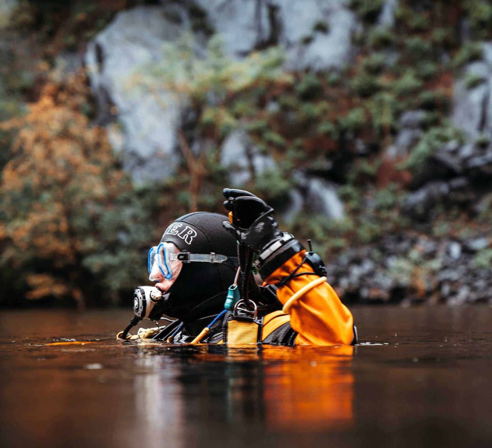 Drysuit diver in lake