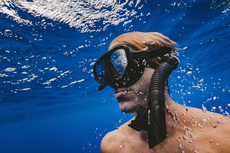 Freediver wearing mask and snorkel underwater