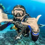 Happy scuba diver underwater