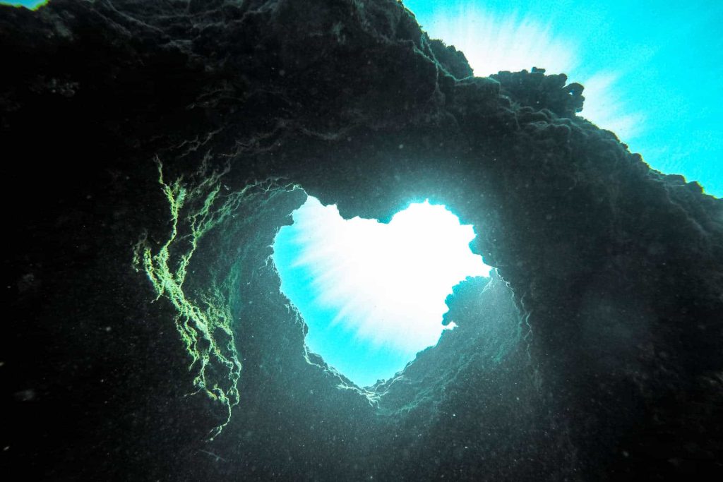 Heart shaped opening between rocks
