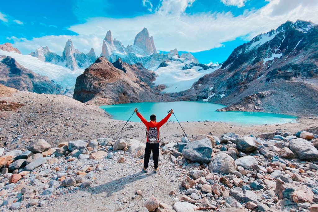 Hiker standing at Laguna de los Tres in Argentina