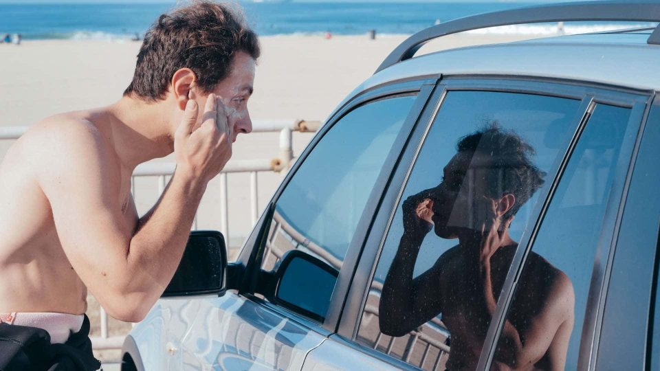 Man applying sunscreen