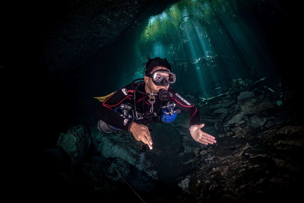 Sidemount cave diver in the Cenotes in Mexico
