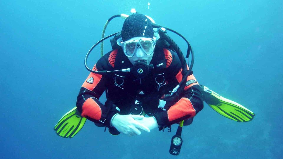Scuba diver hovering underwater