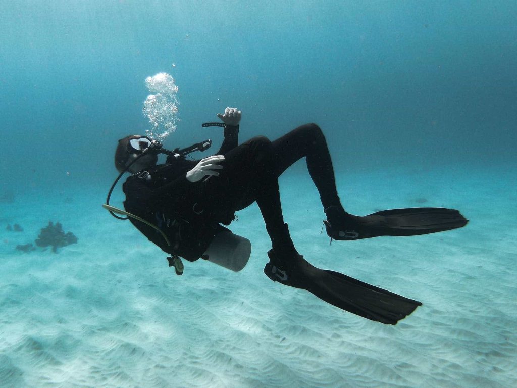 Scuba diver hovering on back