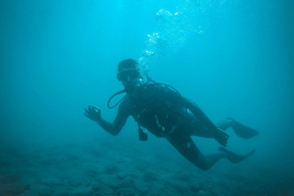 Scuba diver in murky water