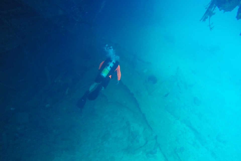 Scuba diver on reef bottom alone