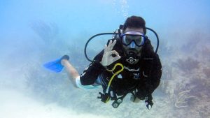 Scuba diver showing okay signal underwater