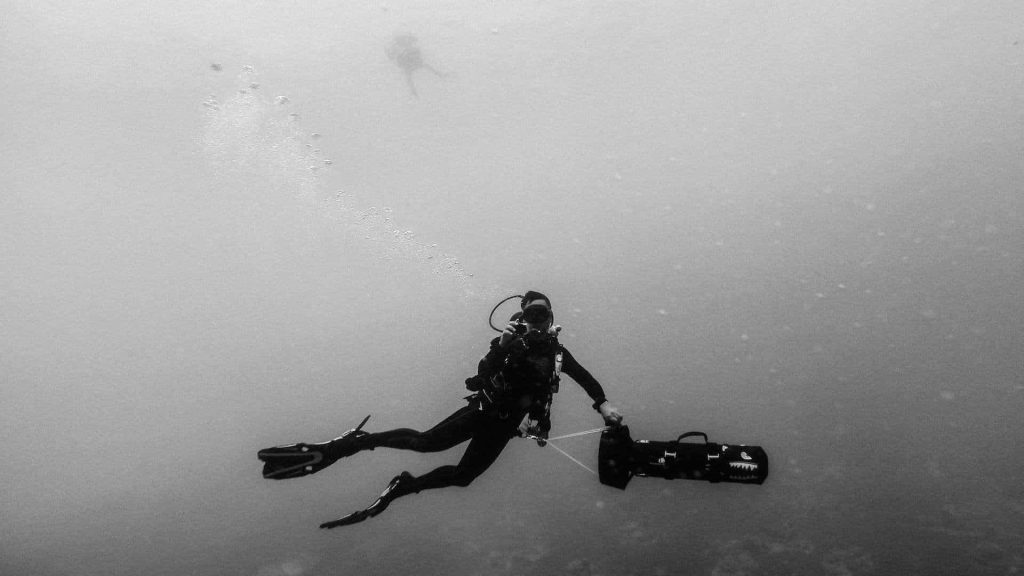 Scuba diver with underwater scooter