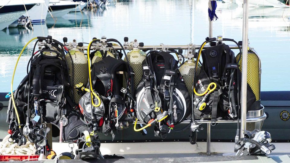 Scuba gear lined up on boat