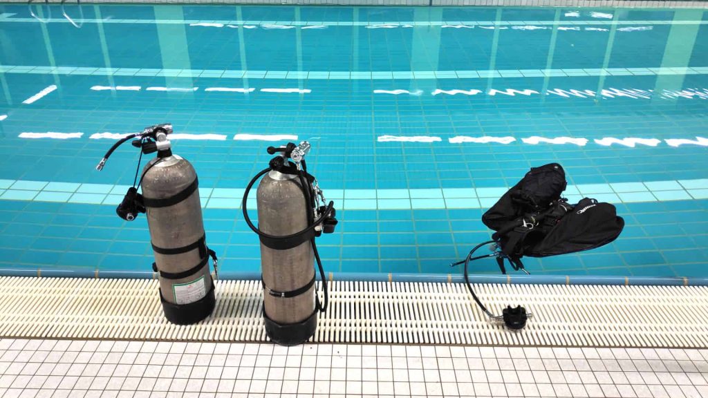 Sidemount diving kit at poolside