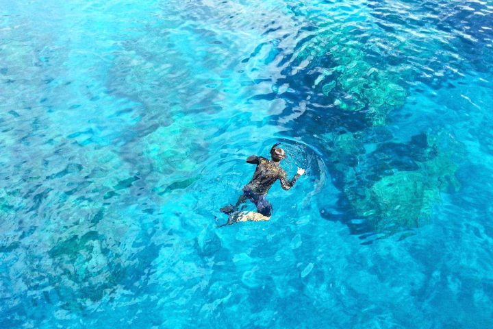 Snorkeler in clear water at surface