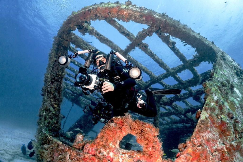 Underwater photographer inside structure